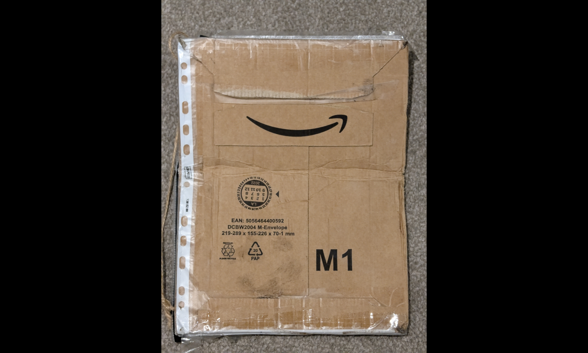 Reverse of Amazon parcel packaging featuring the Amazon logo.